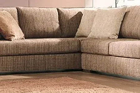 A tan fabric sectional sofa